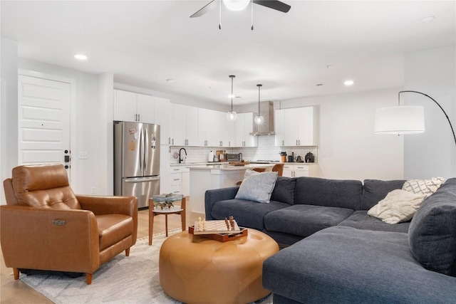 living room with a toaster, recessed lighting, light wood finished floors, and ceiling fan