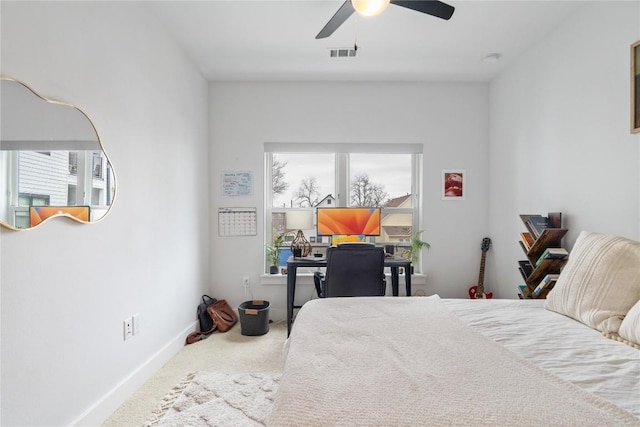 carpeted bedroom featuring visible vents, baseboards, and ceiling fan