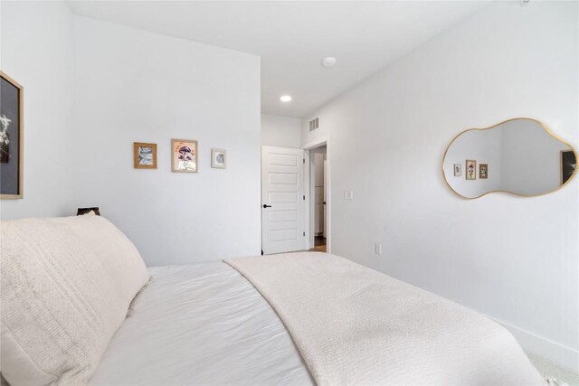 bedroom with recessed lighting and visible vents