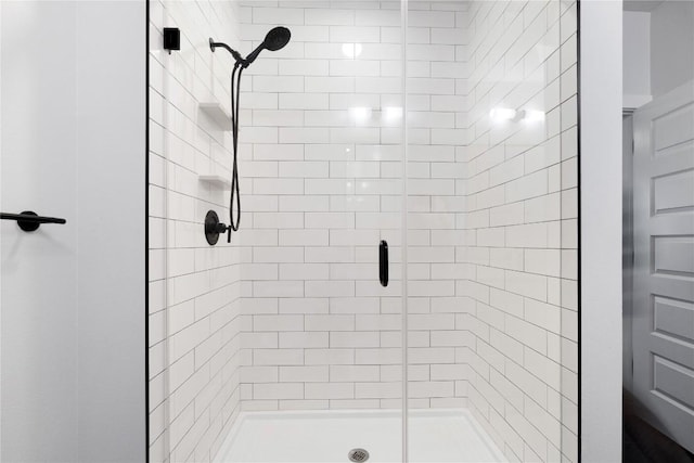 bathroom featuring a shower stall