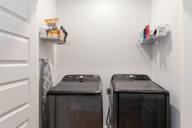 laundry area with laundry area and washing machine and clothes dryer