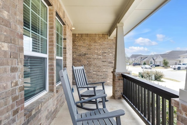 balcony with a residential view and covered porch