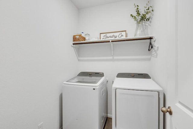 clothes washing area featuring laundry area and separate washer and dryer