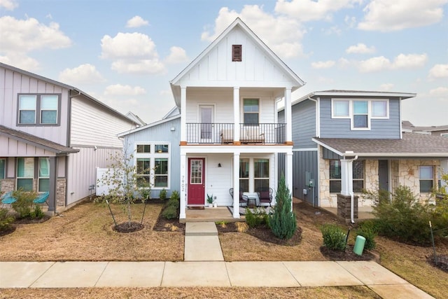 view of front of property featuring a porch, a balcony, and board and batten siding