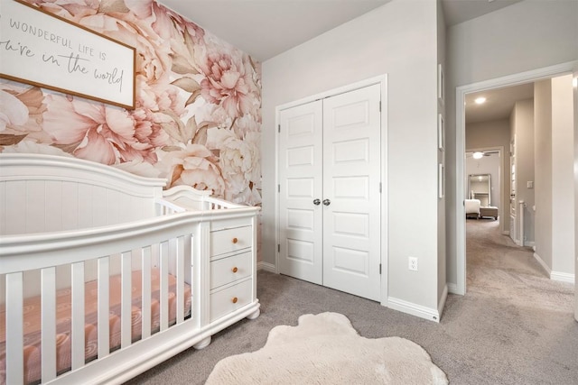 7902 Sutcliffe Dr, Austin, TX 78744 - carpeted bedroom featuring a closet, baseboards, and wallpapered walls