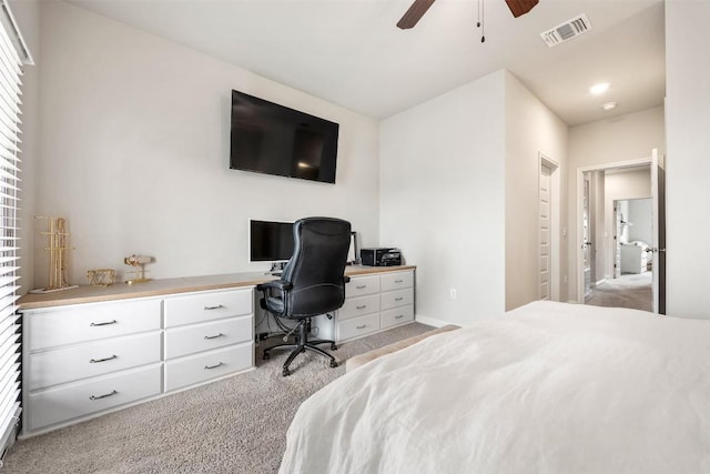 bedroom with visible vents, light carpet, and ceiling fan