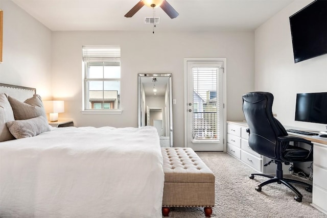 bedroom featuring access to outside, multiple windows, light colored carpet, and visible vents