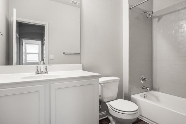 7902 Sutcliffe Dr, Austin, TX 78744 - bathroom featuring toilet, vanity, and bathtub / shower combination