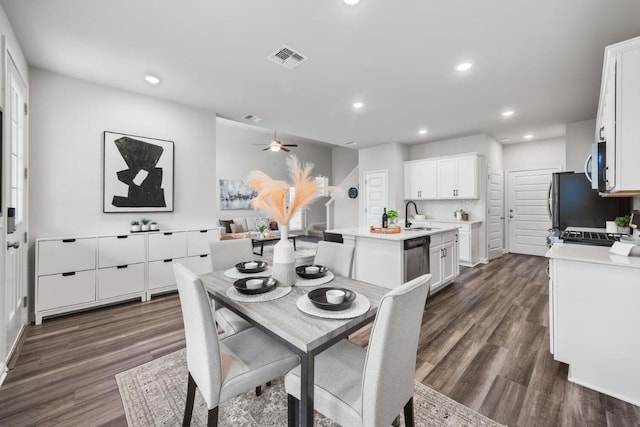 7902 Sutcliffe Dr, Austin, TX 78744 - dining area featuring dark wood-style flooring, recessed lighting, a ceiling fan, and baseboards