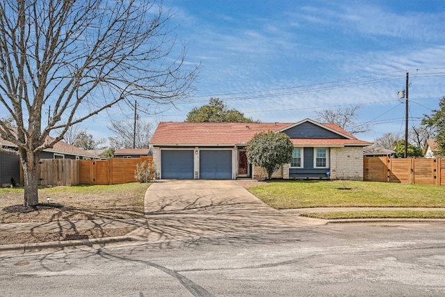 view of front facade with fence, concrete driveway, an attached garage, and a gate