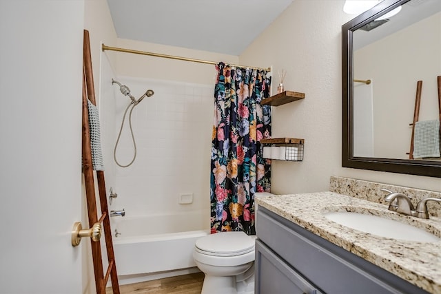 bathroom featuring wood finished floors, toilet, vanity, and shower / bathtub combination with curtain