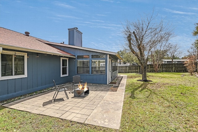 view of yard featuring a patio area, fence private yard, and an outdoor fire pit