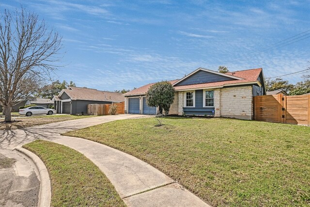 13202 Elysian Fields Cv, Austin, TX 78727 - ranch-style house featuring concrete driveway, a gate, and a garage