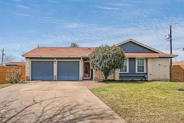 ranch-style home with fence, a front yard, a garage, stone siding, and driveway