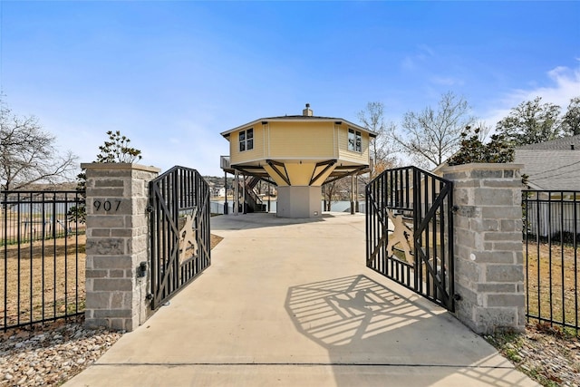 view of gate with fence