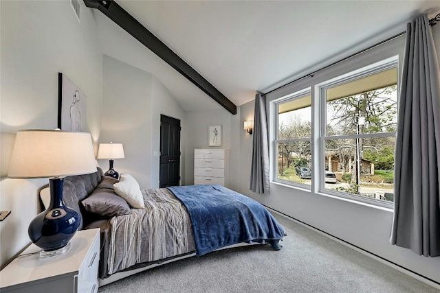 carpeted bedroom featuring lofted ceiling with beams and visible vents