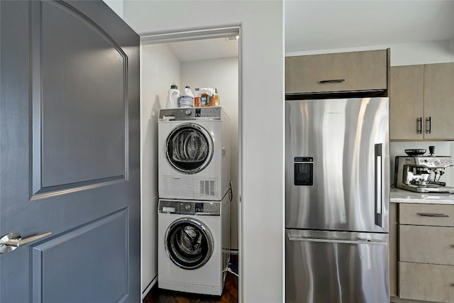 clothes washing area featuring laundry area and stacked washer / drying machine