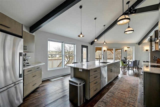 kitchen with a sink, lofted ceiling with beams, dark wood finished floors, stainless steel fridge, and a healthy amount of sunlight