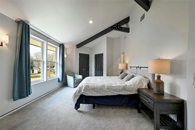 bedroom featuring visible vents, carpet flooring, and vaulted ceiling