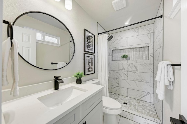 full bathroom with visible vents, toilet, marble finish floor, a stall shower, and vanity