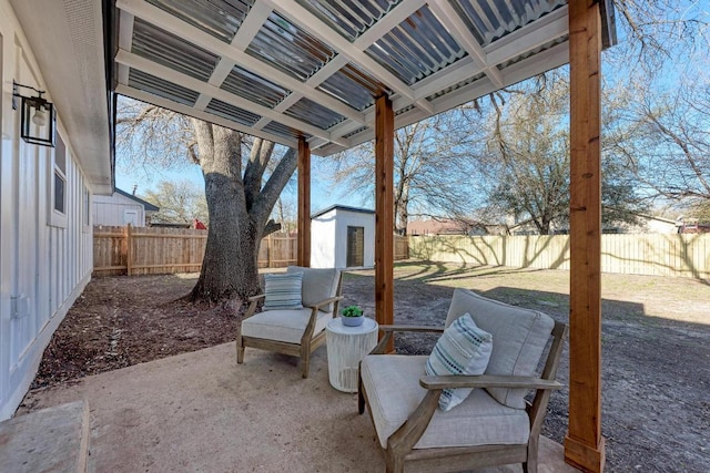 view of patio / terrace featuring a fenced backyard and an outdoor structure