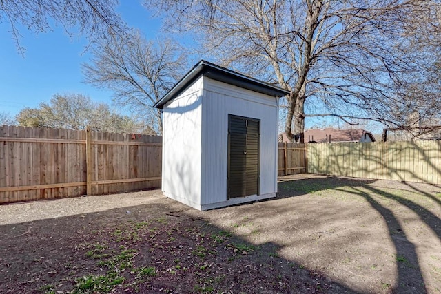 view of shed featuring a fenced backyard