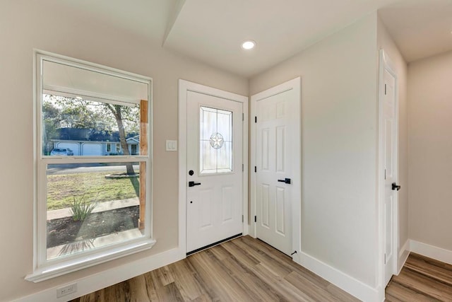 foyer entrance featuring recessed lighting, baseboards, and wood finished floors