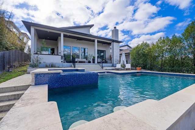 view of pool with a fenced in pool, a patio area, an in ground hot tub, and fence