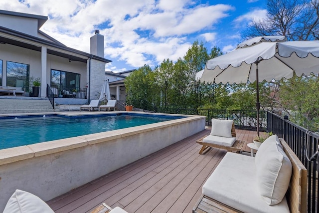 view of pool with a fenced in pool