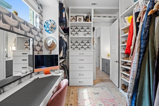 walk in closet featuring visible vents and light wood-type flooring