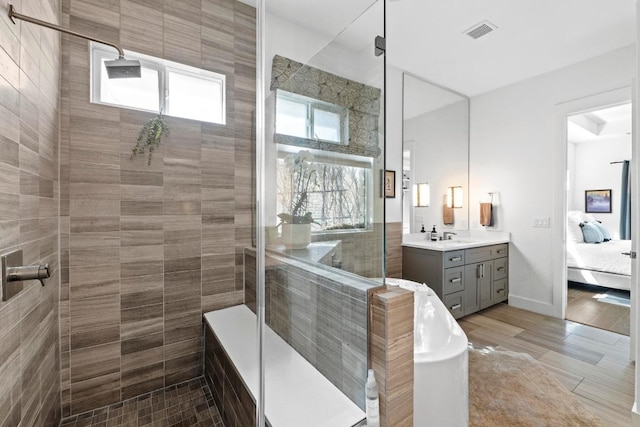 full bath featuring visible vents, ensuite bathroom, vanity, and a shower stall