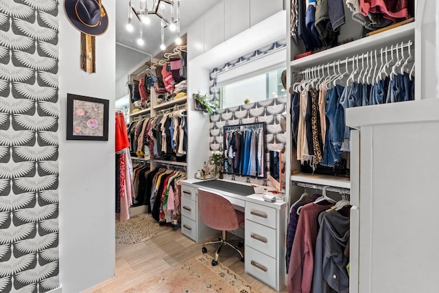 spacious closet featuring light wood-type flooring