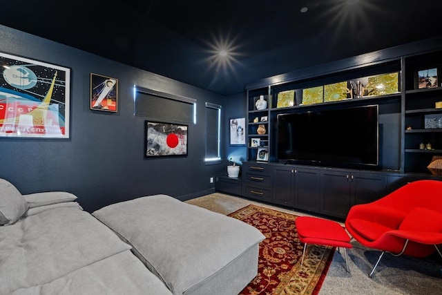 home theater featuring carpet flooring and baseboards