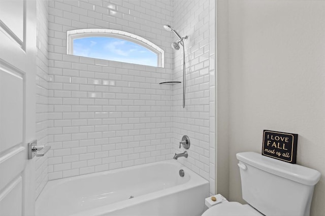 bathroom with toilet and  shower combination