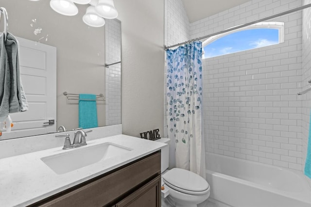 bathroom featuring shower / bath combo with shower curtain, toilet, and vanity