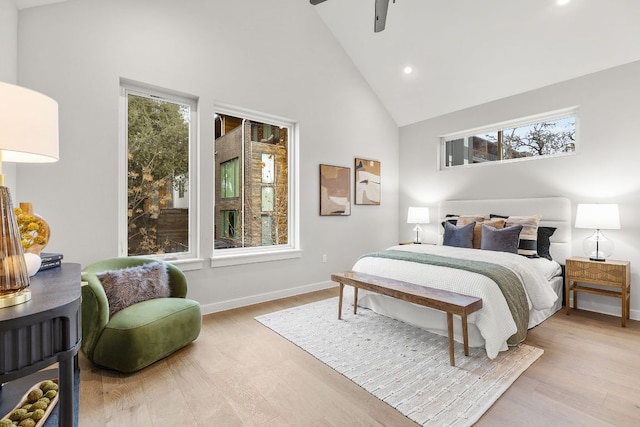 bedroom featuring recessed lighting, high vaulted ceiling, baseboards, and wood finished floors