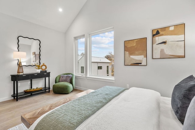 bedroom with recessed lighting, wood finished floors, baseboards, and vaulted ceiling