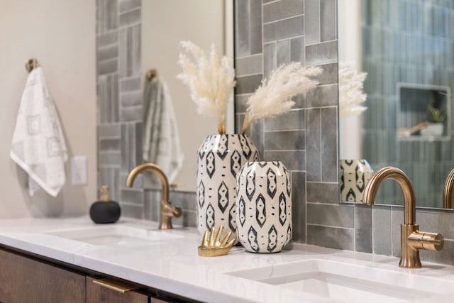 room details featuring tasteful backsplash and vanity