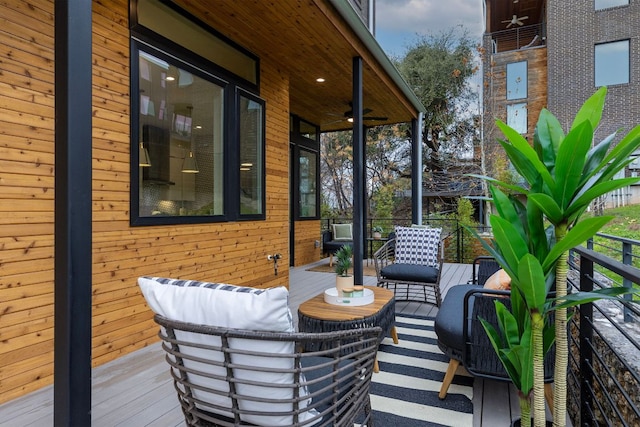 900 S 2nd St Unit 23, Austin, TX 78704 - wooden deck featuring a ceiling fan and an outdoor hangout area