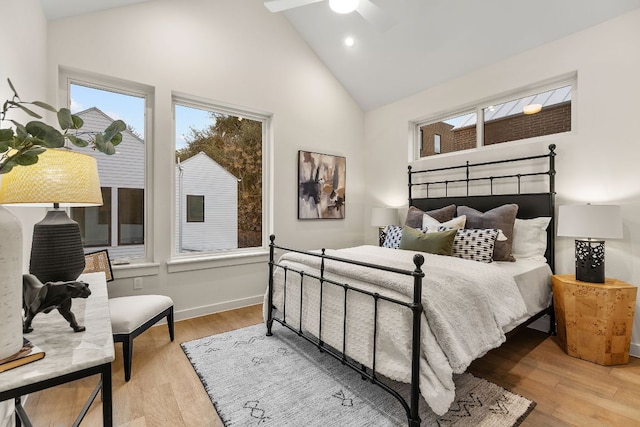 bedroom featuring recessed lighting, high vaulted ceiling, baseboards, and wood finished floors