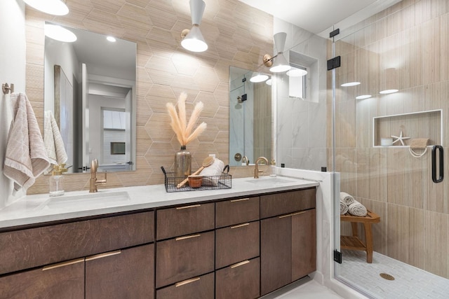 bathroom with a shower stall, tile walls, and a sink