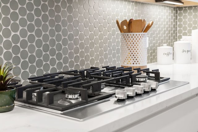 900 S 2nd St Unit 22, Austin, TX 78704 - kitchen view of stainless steel gas cooktop and wallpapered walls