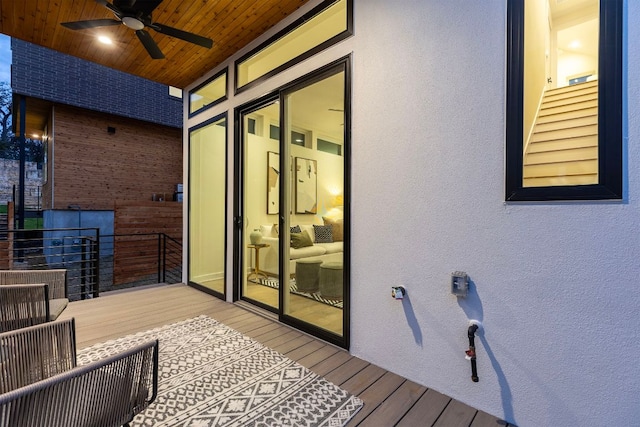 wooden deck featuring a ceiling fan