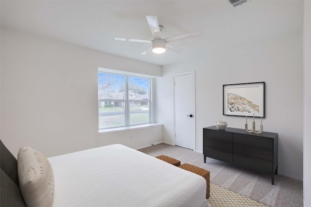 bedroom featuring baseboards, carpet, and a ceiling fan