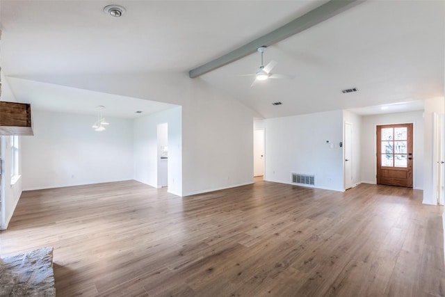 unfurnished living room featuring visible vents, wood finished floors, vaulted ceiling with beams, and ceiling fan with notable chandelier