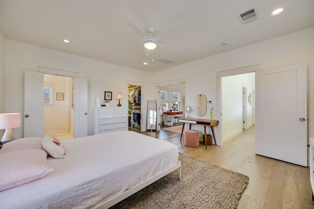 bedroom featuring recessed lighting, visible vents, multiple windows, and light wood finished floors