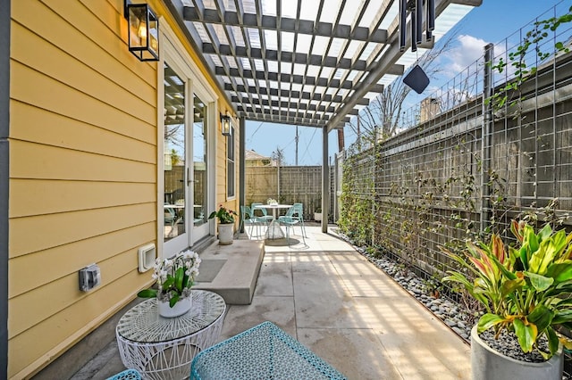 view of patio / terrace featuring a pergola, outdoor dining area, and a fenced backyard