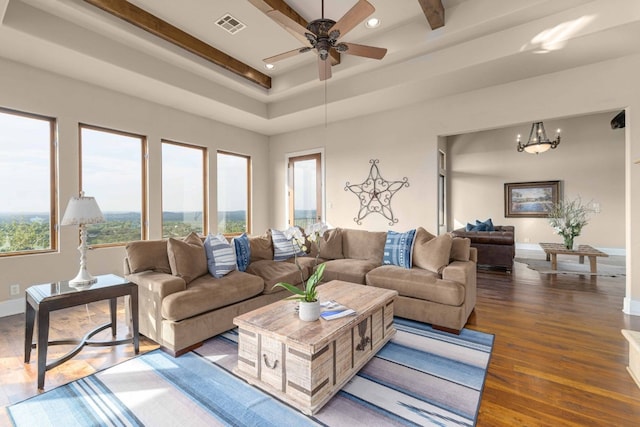9104 Atwater Cv, Austin, TX 78733 - living room featuring wood finished floors, a ceiling fan, baseboards, a raised ceiling, and recessed lighting