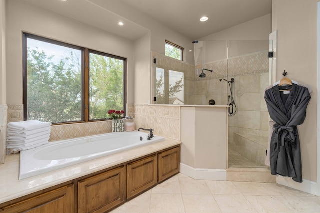 9104 Atwater Cv, Austin, TX 78733 - bathroom featuring walk in shower, a garden tub, and recessed lighting