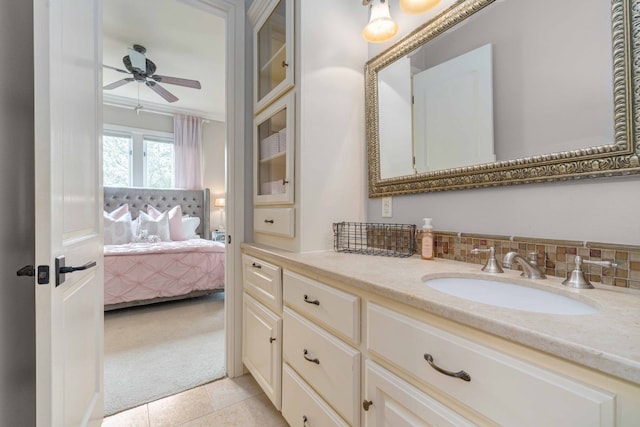 9104 Atwater Cv, Austin, TX 78733 - ensuite bathroom featuring a ceiling fan, vanity, and tile patterned flooring